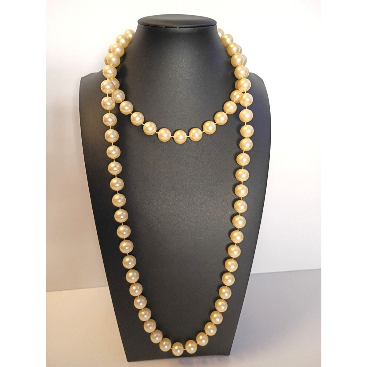 Elegant Vintage Style Rope Necklace features Warm, Cream Colored Faux Pearls