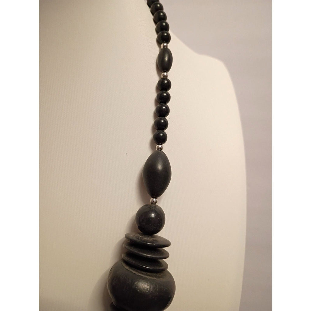 Vintage signed Monet Necklace of Various Shapes of Wooden beads also large Metal