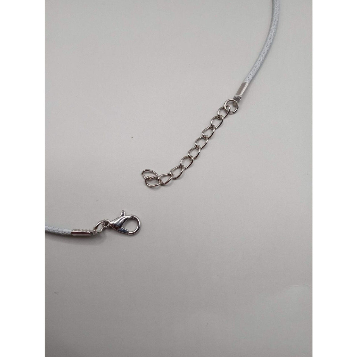 Pointed Turquoise Stone Pendant Necklace on Gray Cord