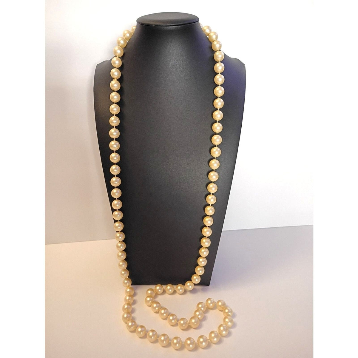 Elegant Vintage Style Rope Necklace features Warm, Cream Colored Faux Pearls