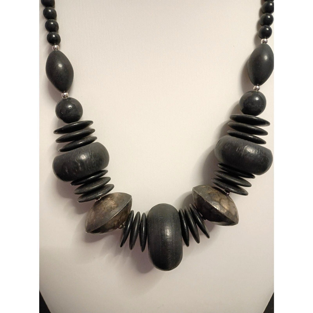 Vintage signed Monet Necklace of Various Shapes of Wooden beads also large Metal
