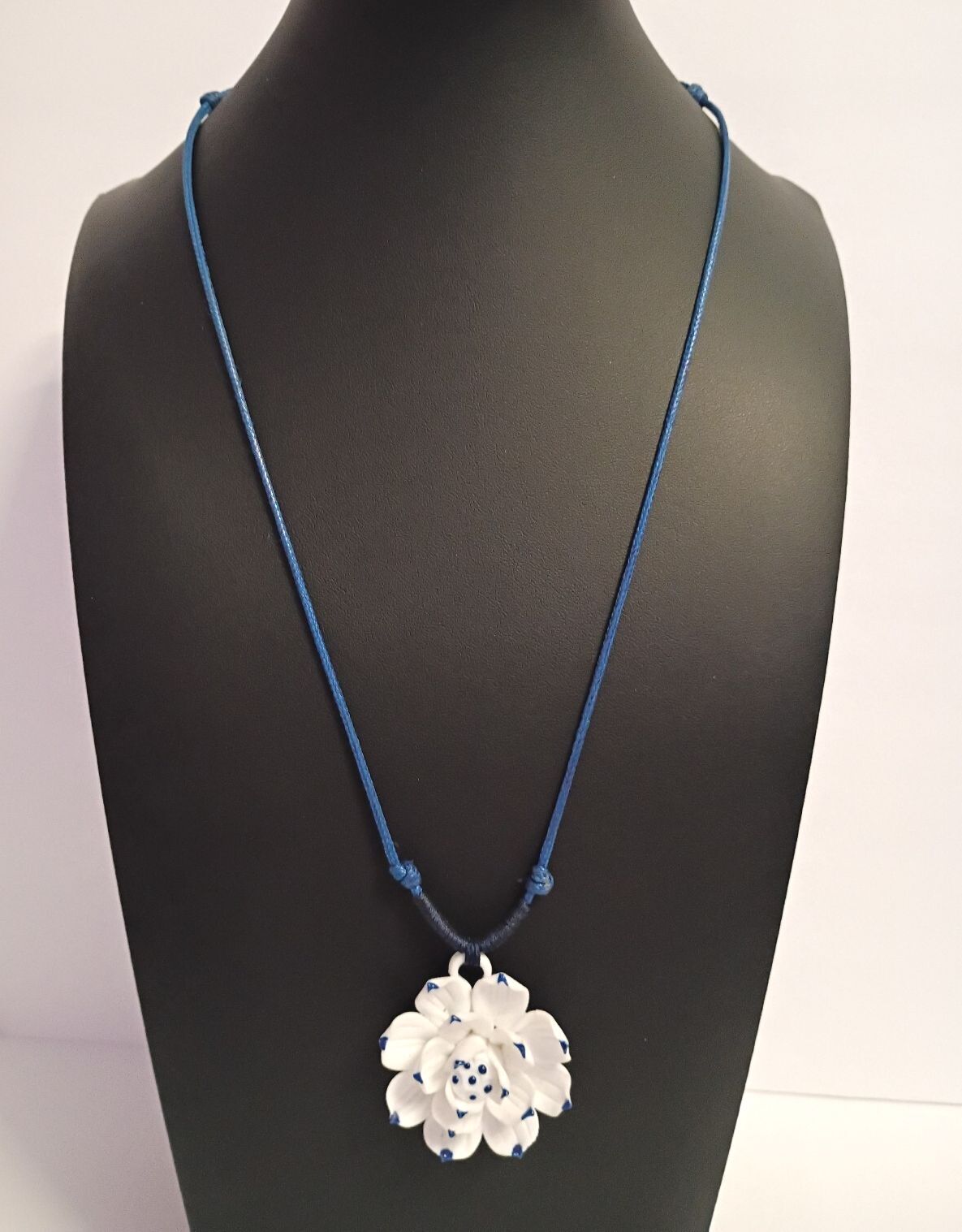 Dainty Little Necklace of a White Flower Pendant on a Blue Adjustable Cord
