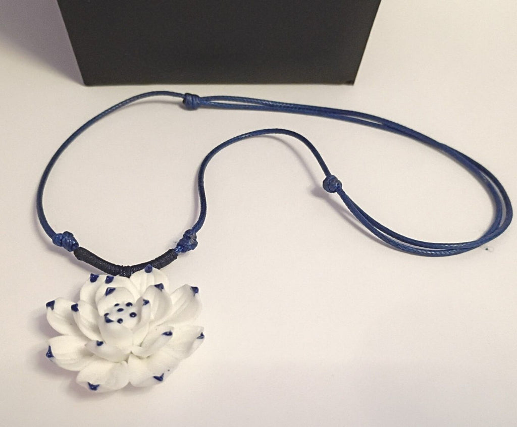 Dainty Little Necklace of a White Flower Pendant on a Blue Adjustable Cord