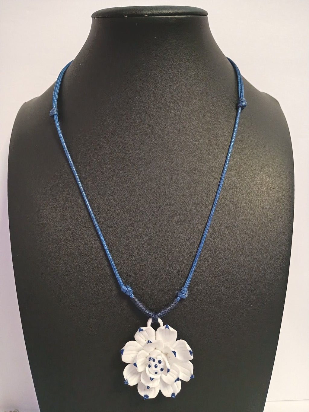 Dainty Little Necklace of a White Flower Pendant on a Blue Adjustable Cord