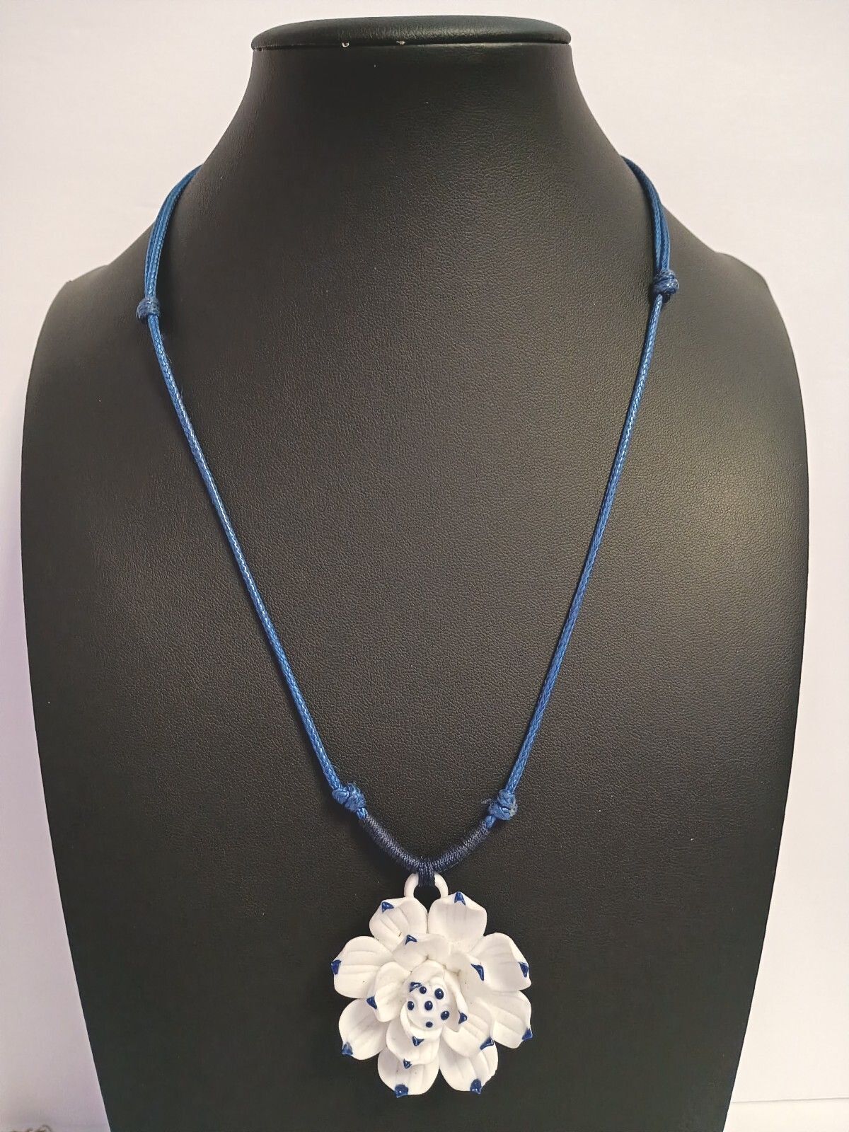 Dainty Little Necklace of a White Flower Pendant on a Blue Adjustable Cord