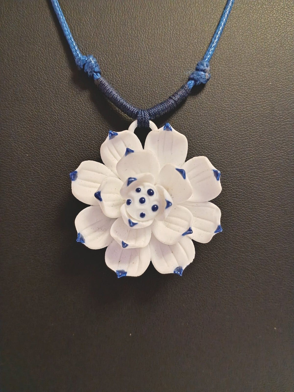 Dainty Little Necklace of a White Flower Pendant on a Blue Adjustable Cord