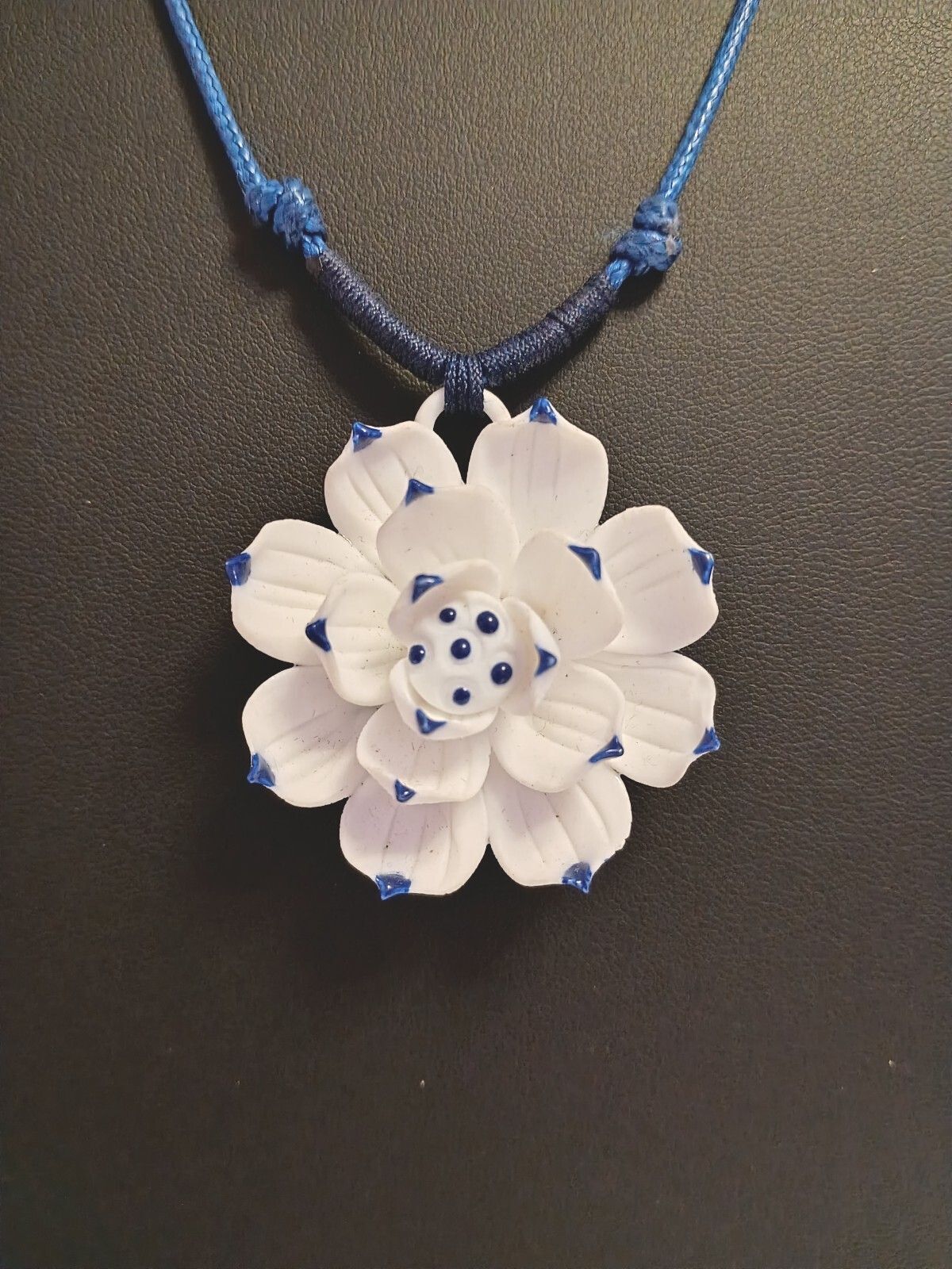Dainty Little Necklace of a White Flower Pendant on a Blue Adjustable Cord